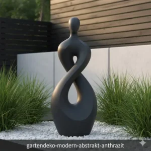 Stilvolle gartendeko figuren abstrakt modern in Anthrazit-Optik auf hellem Kiesweg.